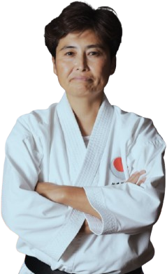 Yuko Hirayama Sensei in karate gi, arms crossed